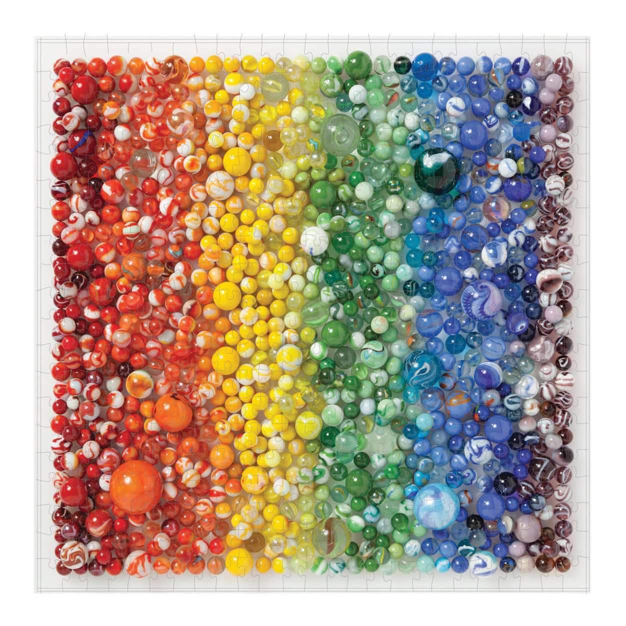 Puzzle of marbles arranged in a rainbow